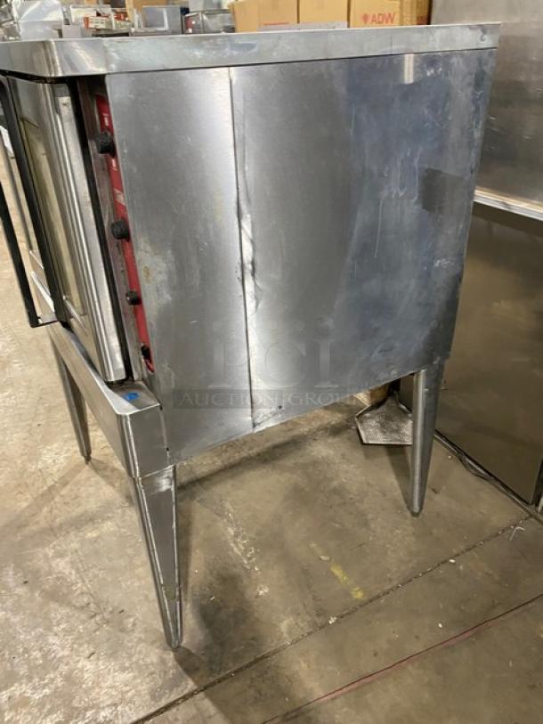 Blodgett stainless steel electric convection oven, single stacked, on legs. Includes wired rack, visible control knobs. Used condition.