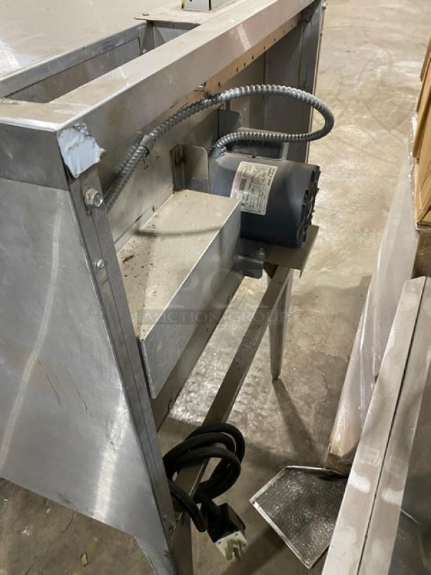 Blodgett single stack convection oven, stainless steel, electric powered. Includes wired oven rack, on legs. Visible wear on surface.