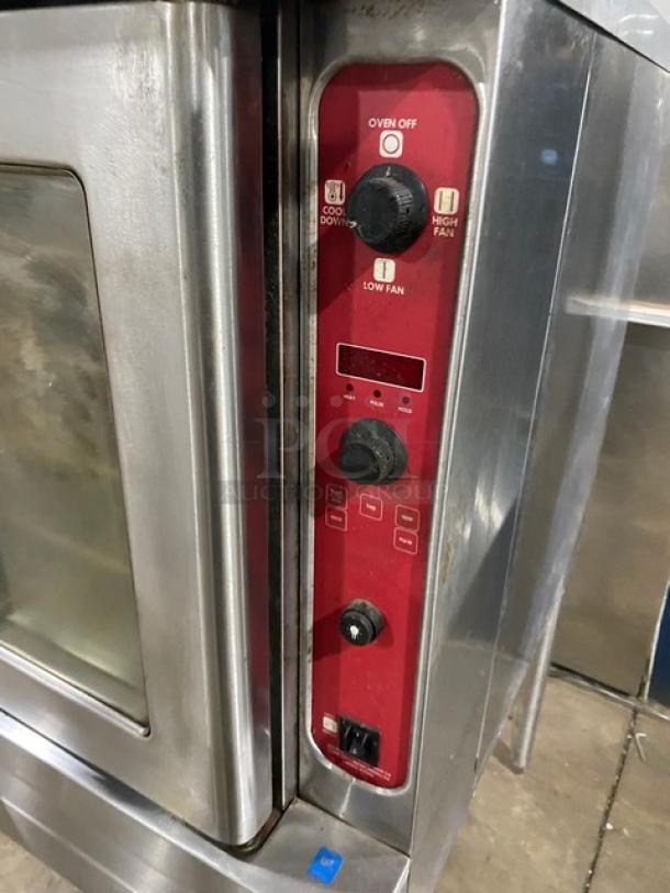 Blodgett stainless steel single stacked electric convection oven with wired rack, on legs, features control panel with settings.