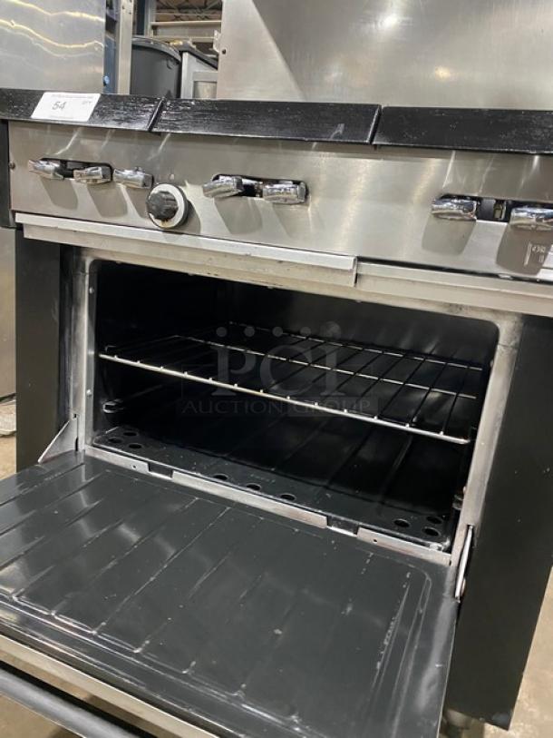 Garland stainless steel 6-burner range/oven combo, natural gas, with backsplash, overhead salamander shelf, wired oven rack, on legs.