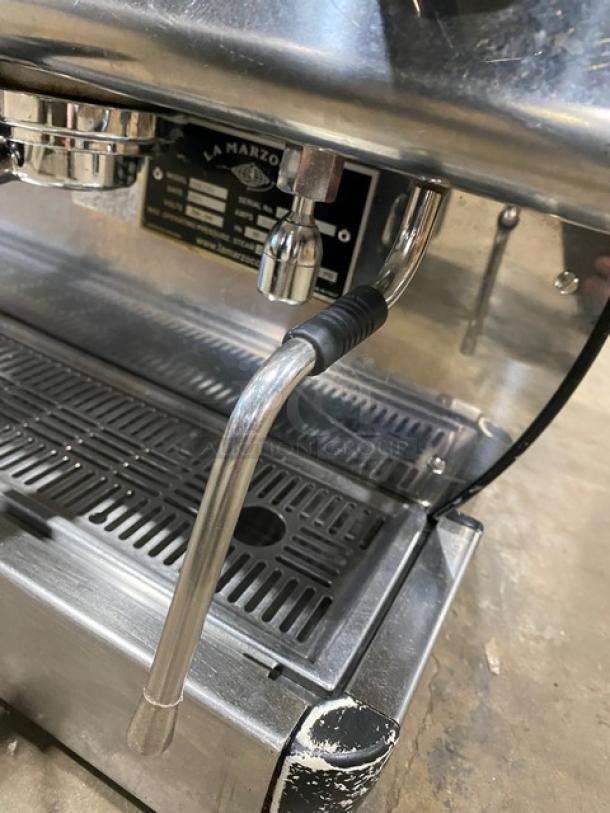 La Marzocco GB/5 2 AV commercial espresso machine, stainless steel, with steam wand and drip tray, showing label and condition.