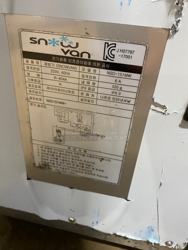 Snow Van NSD151MW electric countertop snowflake ice machine, stainless steel, 220V. Manufacturer's label visible.