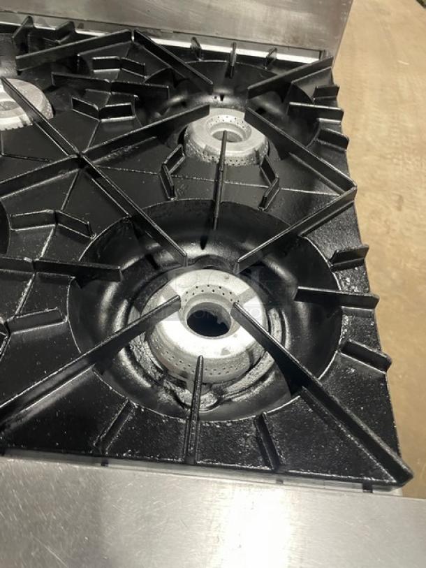 Vulcan stainless steel split-top range with 4 burners shown. Clean condition, part of commercial double oven combo.