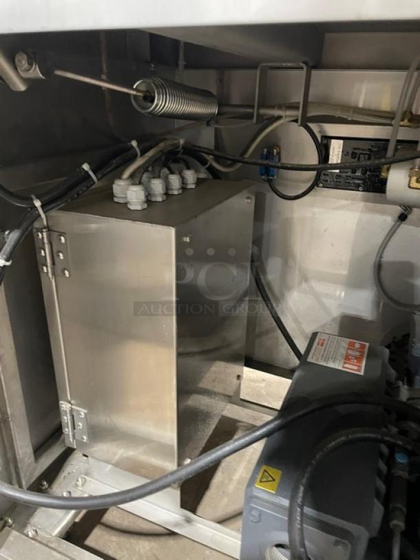 Promax stainless steel electric vacuum tray sealer, digital controls, on casters, in working condition.