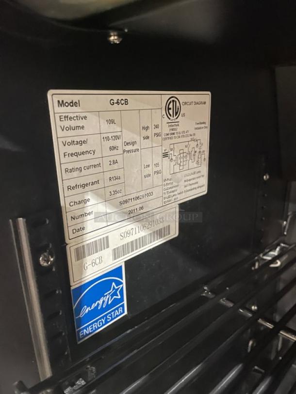 IDW.Global Monster Style Commercial Black Single Glass Door Countertop Beverage Merchandiser, Model G6CB, Energy Star Certified, with wired rack. ETL and voltage details on visible label.