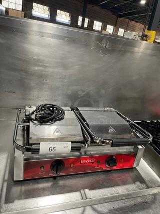 Avantco commercial stainless steel dual panini grill with grooved grates, thermostatic control, used condition, model plate visible.