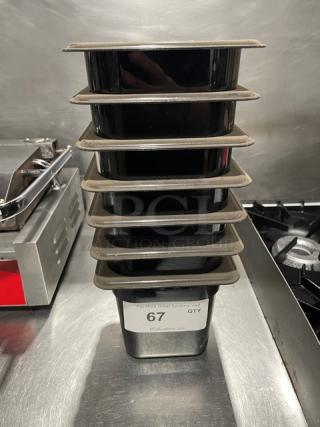 Cambro black commercial food pans stacked, new condition, label showing auction lot 67 for quantity.