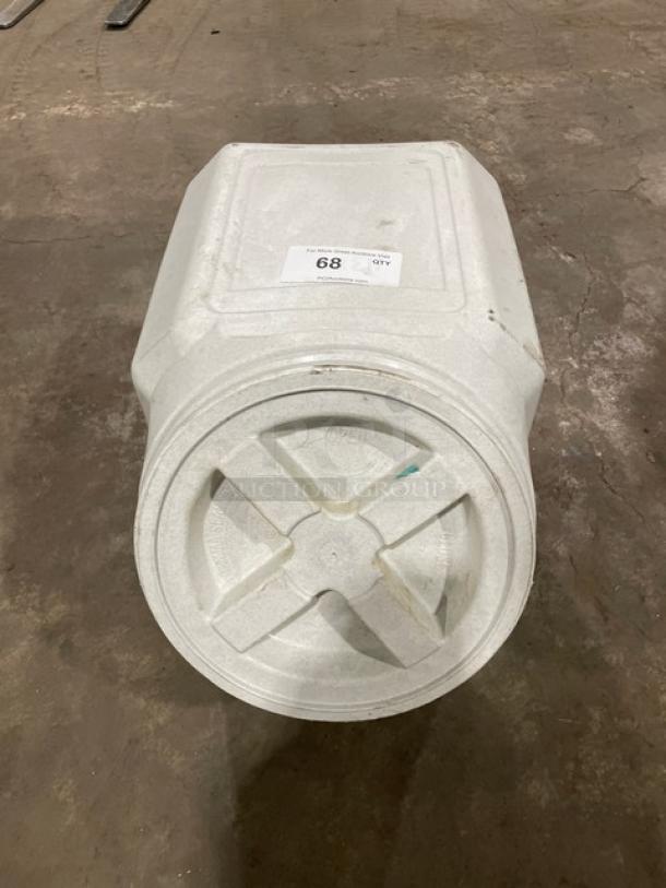 Commercial stackable countertop ingredient bin with twist-off top, in used condition, white, showing item label "68."