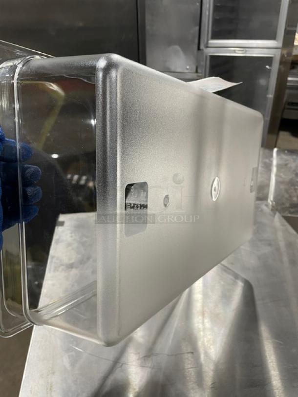 New Cambro clear polycarbonate food pan, commercial grade, durable design, pristine condition, visible product labels.
