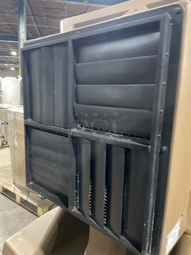 Port-A-Cool Jet Stream 2400 PACJS2400 heavy-duty evaporative cooler on casters, black exterior vents, model tag visible.