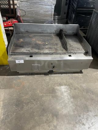 WoodStone stainless steel gas countertop plancha griddle, WSPL48364CT, with back & side splash, on legs, used condition.