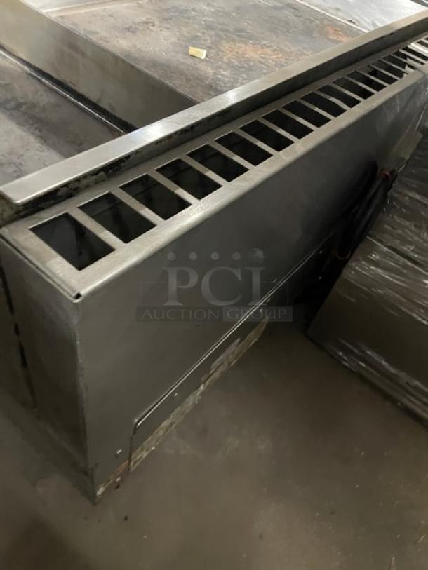 WoodStone stainless steel countertop split top plancha griddle, model WSPL48364CT, natural gas, with back and side splash.