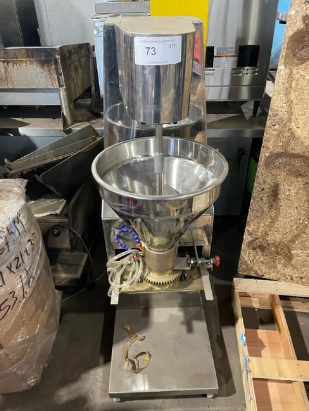 Stainless steel meatball forming machine, electric-powered, 220V 3 phase, heavy-duty, in good condition with visible controls.