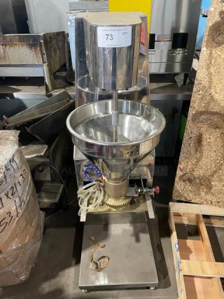 Stainless steel meatball forming machine, electric-powered, 220V 3 phase, heavy-duty, in good condition with visible controls.