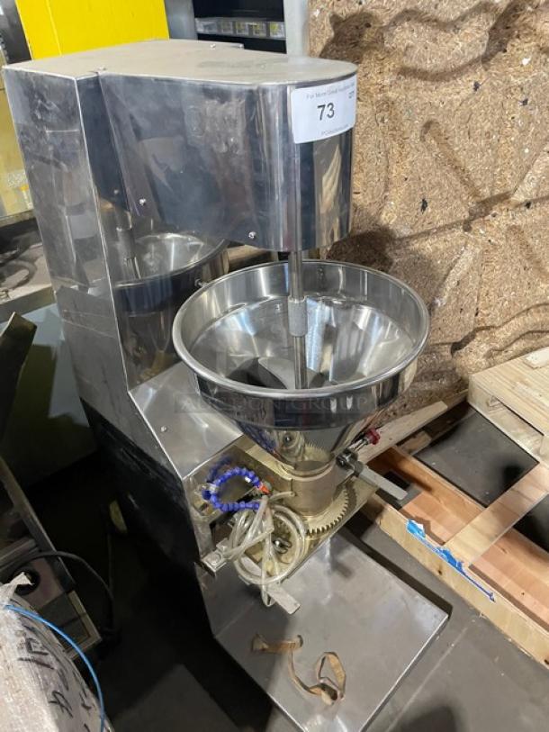 Commercial stainless steel meatball forming machine, electric-powered, 220V 3-phase. Heavy-duty with noticeable wear. Tag: Lot 73.