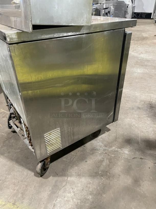 True TUC-27 stainless steel undercounter refrigerator, single door, chrome plated rack, on casters, model TUC27, SN 1-4118569.