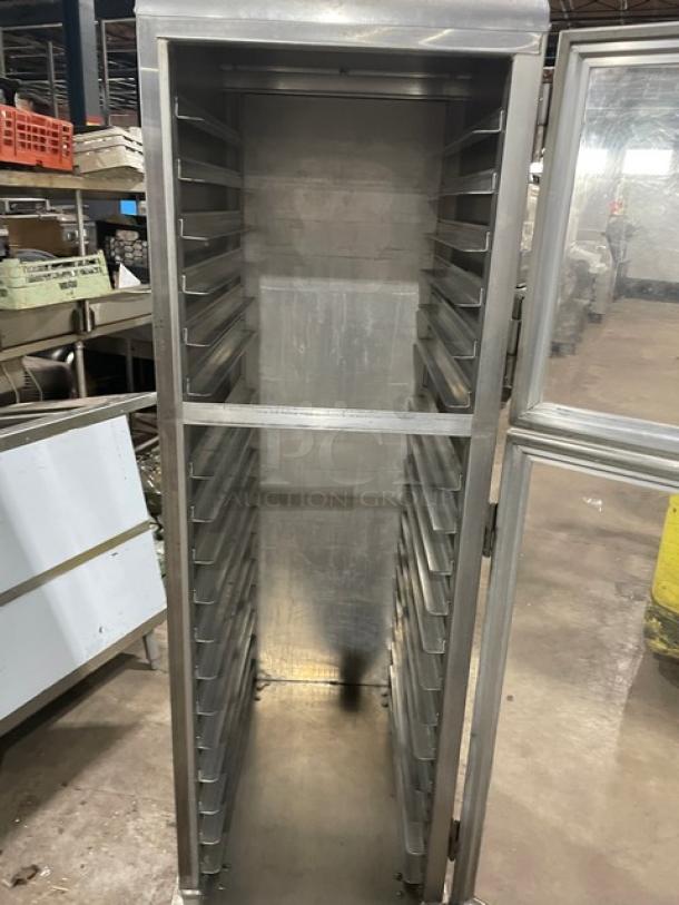 Lockwood CA72RR18SR commercial clear half door display/transport cabinet with built-in pan slides, on casters.