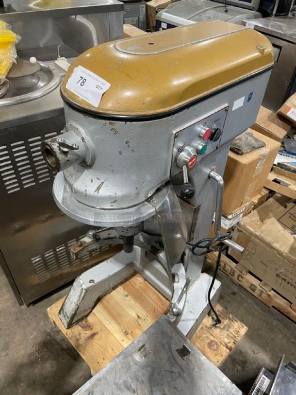 Commercial heavy-duty planetary mixer, Model MIX8140, 220V, single phase, on legs, worn finish with visible controls and label.