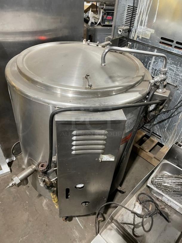 Groen stainless steel 40-gal steam kettle, model AH/1-40, with swing spout faucet. Natural gas powered, on legs, serial SN: 137002.