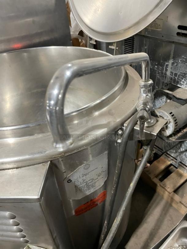 Groen stainless steel steam jacketed 40-gallon kettle, model AH140. Features a swing spout faucet and is mounted on legs.
