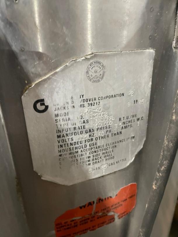 Groen AH140 stainless steel steam kettle with ID tag visible, showing serial number 137002 and natural gas specifications.