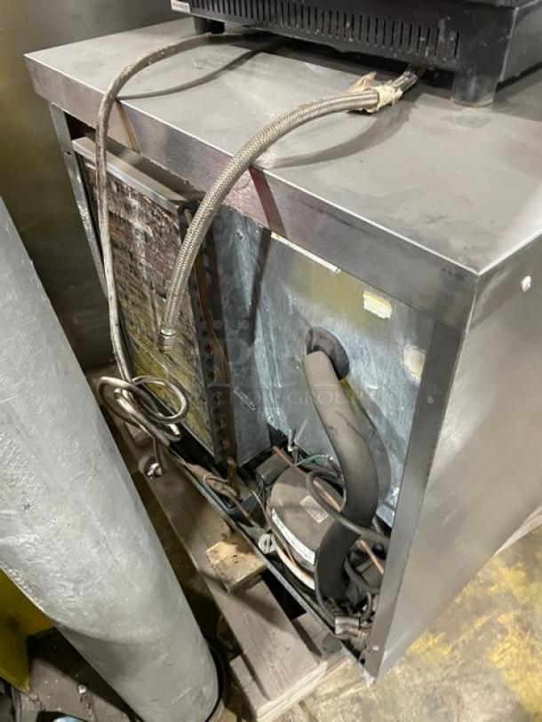 Delfield Enodis Series 406STAR2 stainless steel undercounter refrigerator, showing back components. 115V, single phase.