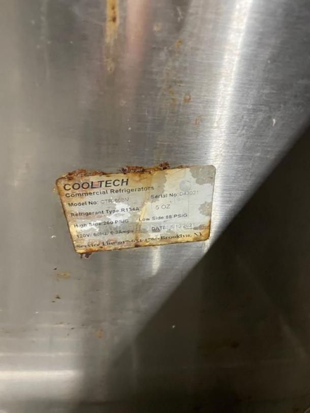 CoolTech CTR-60BM stainless steel 2-door refrigerated prep table, tag shows model and serial number, on casters, used condition.