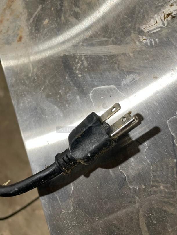 Power cord plug detail for CoolTech CTR60BM refrigerated prep table, showing standard 120V connection.
