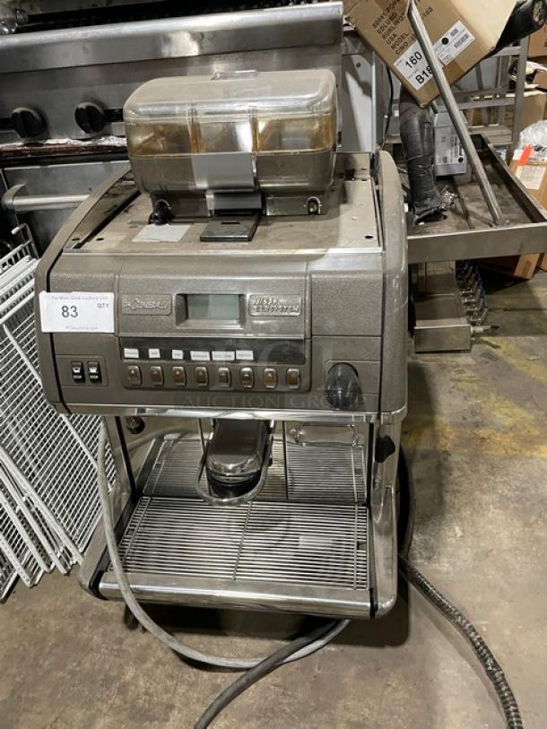 LaCimbali commercial electric espresso machine, stainless steel steam wand, drip tray, clear bean hopper, on legs.
