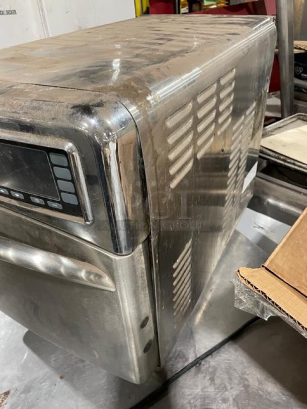 TurboChef NGO commercial stainless steel rapid cook oven with digital control, shows signs of use, electric, on legs.