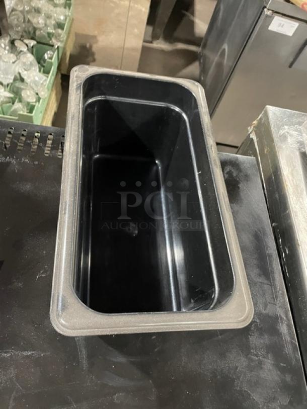 Cambro Commercial Black Food Pan, rectangular shape, durable plastic, excellent condition, ideal for foodservice use.