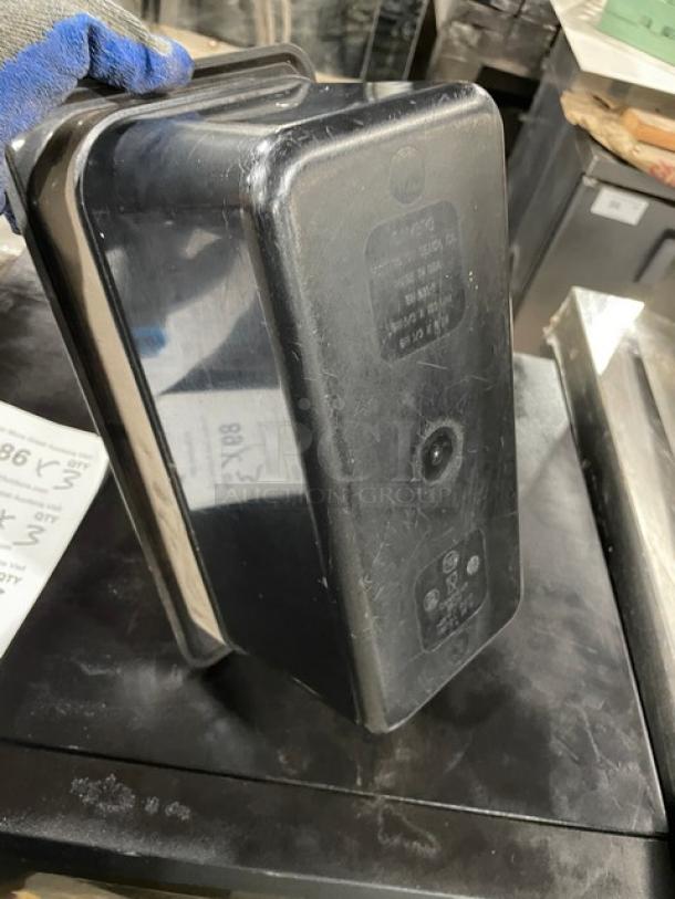 Cambro commercial black food pan, durable plastic, visible wear, embossed markings for brand and specifications.