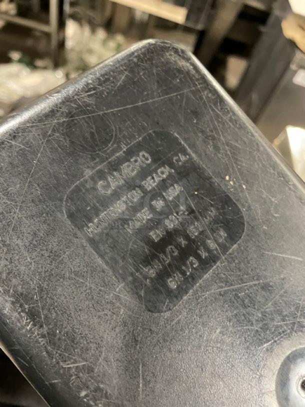 Cambro Commercial Black Food Pan, made in USA, visible wear, label states Huntington Beach, CA, model details unclear.
