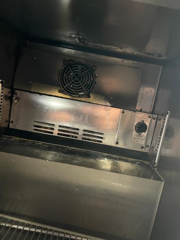 Turbo Air M3 Series undercounter refrigerator interior with stainless steel finish, visible fan, and control knob.