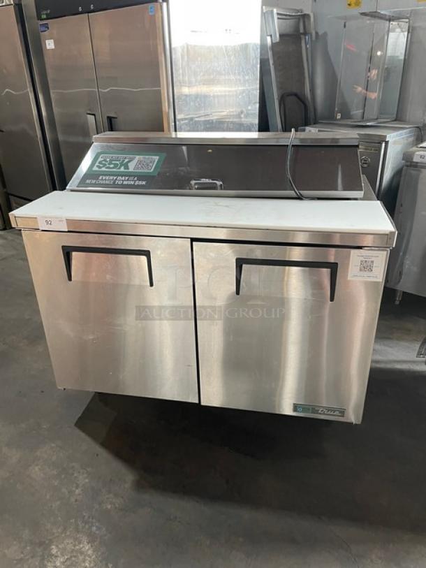 True Commercial Stainless Steel 2 Door Refrigerated Bain Marie Style Prep Table, Model TSSU-48-12-HC, with cutting board, on casters.