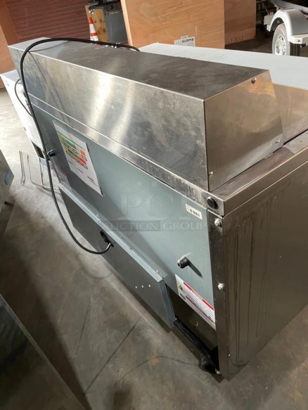 True TSSU-48-12-HC refrigerated prep table, stainless steel, 2 doors, includes cutting board, on casters, 115V, serial number 10329246.