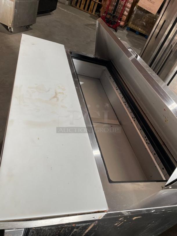 True Commercial Stainless Steel 2 Door Refrigerated Bain Marie Prep Table, Model TSSU-48-12-HC, with Cutting Board, on Casters.