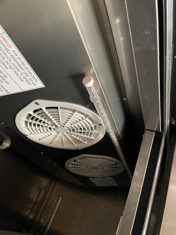 Turbo Air M3F47-2-N commercial freezer interior, featuring dual fans and poly-coated wired rack. Energy Star certified.