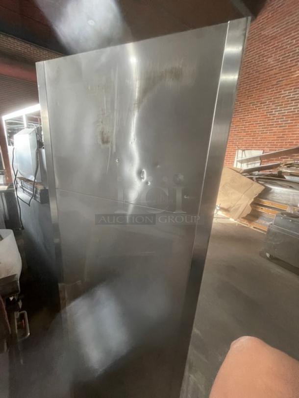 True T-23F Commercial Stainless Steel Reach-In Freezer, Energy Star Certified, with Poly Coated Wired Rack, dented side.