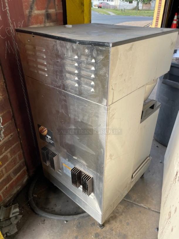 Bunn Soft Heat Series DUALSHDBC stainless steel dual coffee brewer with hot water dispenser, visible wear, on legs.