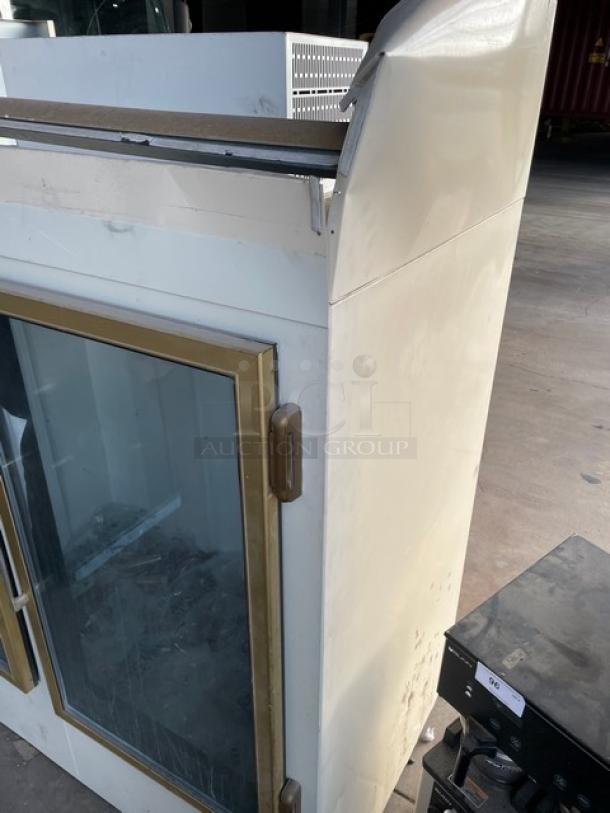 Leer Commercial White Double Glass Swing Door Reach-In Ice Merchandiser Freezer, Model IS67AG50, in used condition.