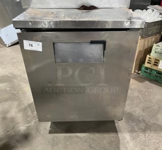 True Commercial Stainless Steel Undercounter Refrigerator, Model TUC-27, with chrome wired rack, on casters, used condition.
