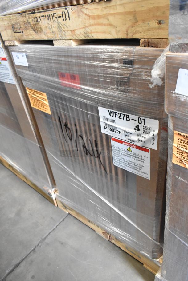 Brand new Hoshizaki WF27B-01 stainless steel freezer in box. Single door, 115V, 1 phase. Markings and labels visible on packaging.