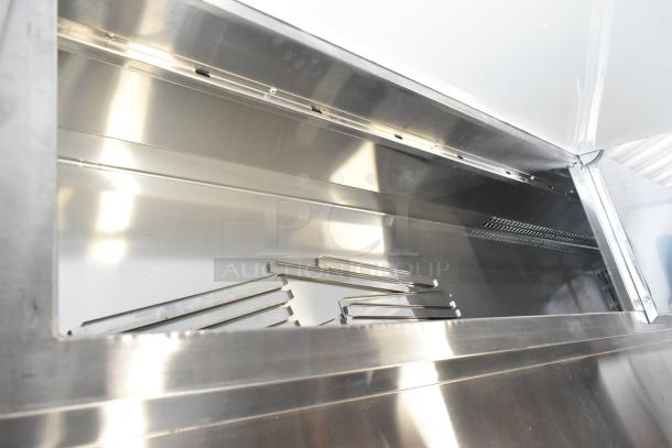 Brand new Avantco 178SSPPT3 stainless steel commercial pizza prep table, 2024 model, scratch and dent condition, 115V.