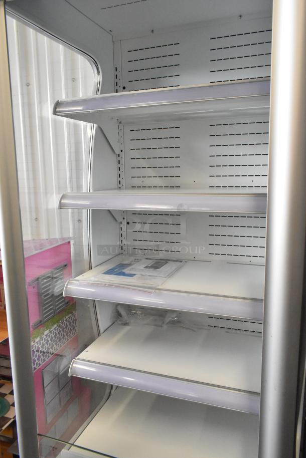Brand new Avantco WVAC-28HC 28" refrigerated air curtain merchandiser. Features shelves, scratch and dent condition.