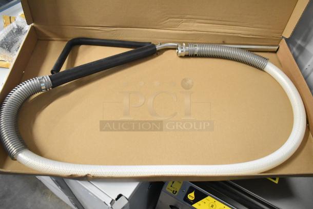 Brand new Vito XS fryer oil filter hose in a cardboard box, featuring stainless steel and black rubber components. Commercial grade.