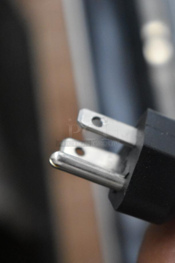 Close-up of a power plug for a 2023 Vollrath RDE7160 60" refrigerated display cabinet. Model: 40844, 120V, 1 Phase.