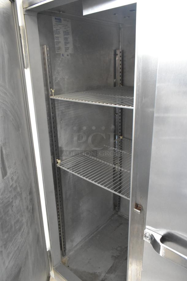 McCall 4-4045F stainless steel commercial 2-door reach-in freezer, poly coated racks, 115 volts, 1 phase, interior view.