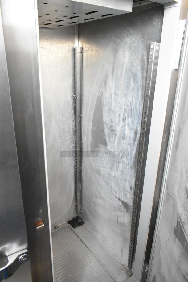 McCall 4-4045F stainless steel 2 door reach-in freezer interior with poly-coated racks, 115 volts, 1 phase, commercial grade.