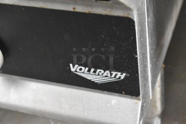 Vollrath stainless steel gas charbroiler grill, used, featuring brand logo. Ideal for commercial use. Condition shows wear.